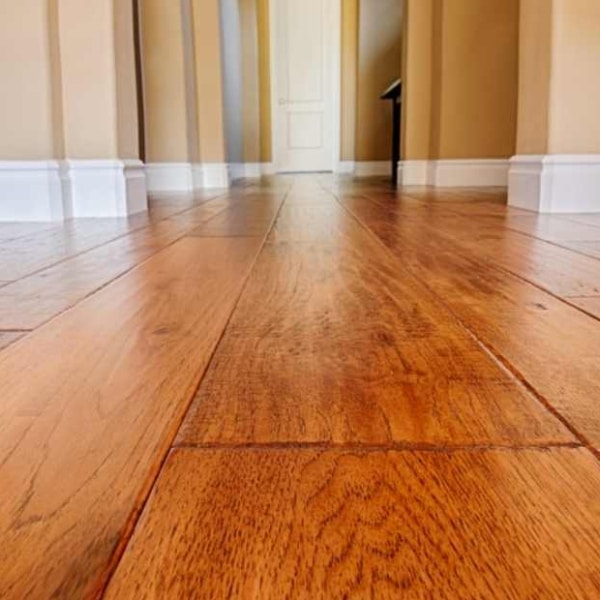 Newly installed engineered hardwood flooring in home.