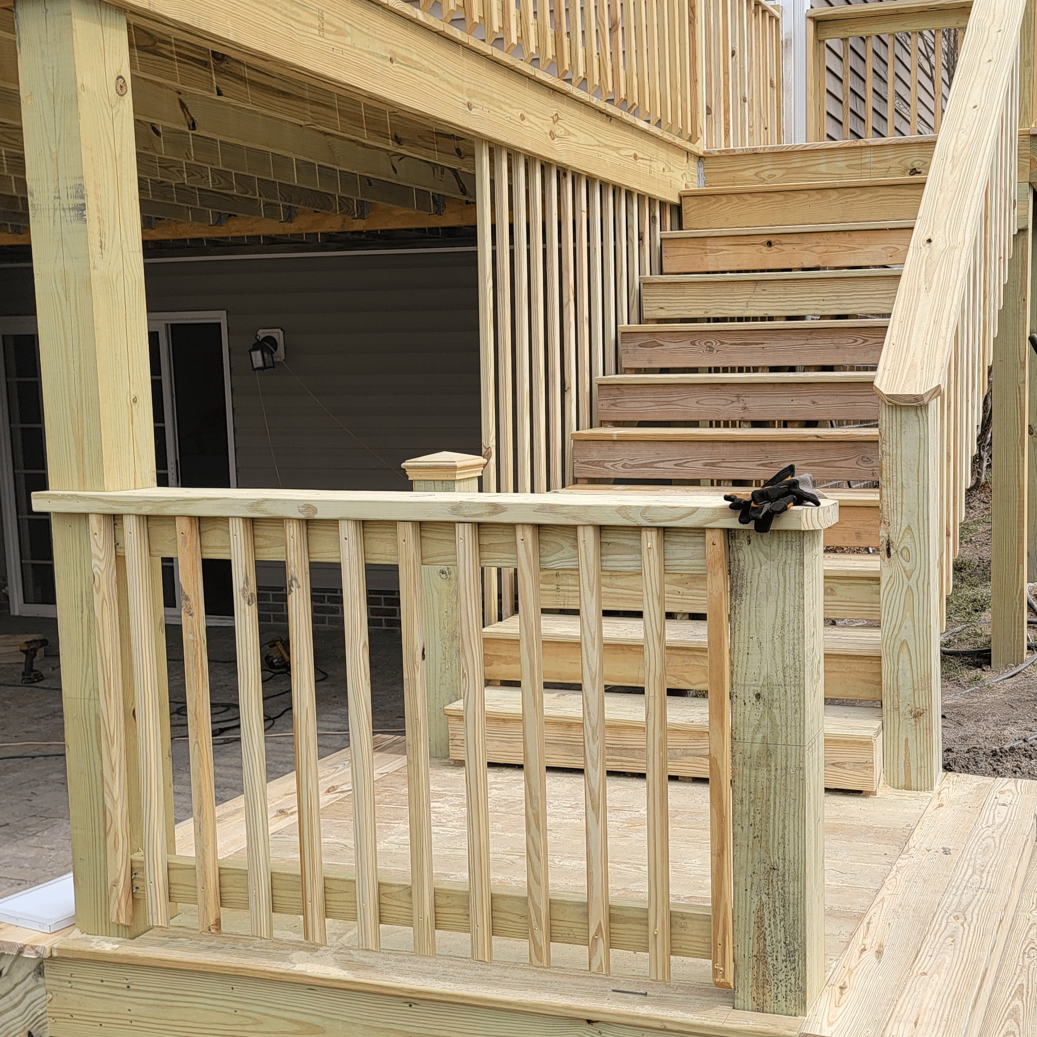 Newly installed deck with railings at a house in Raeford, NC.