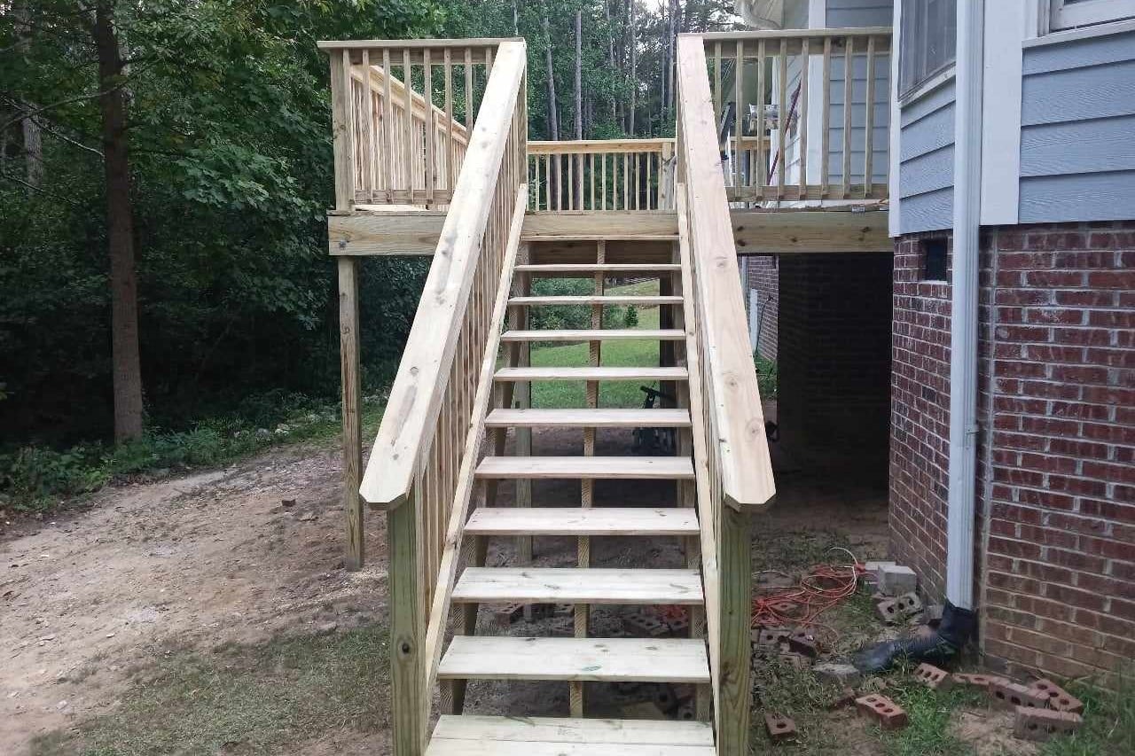After photo of newly renovated deck with all new lumber on back of Fayetteville, NC home.