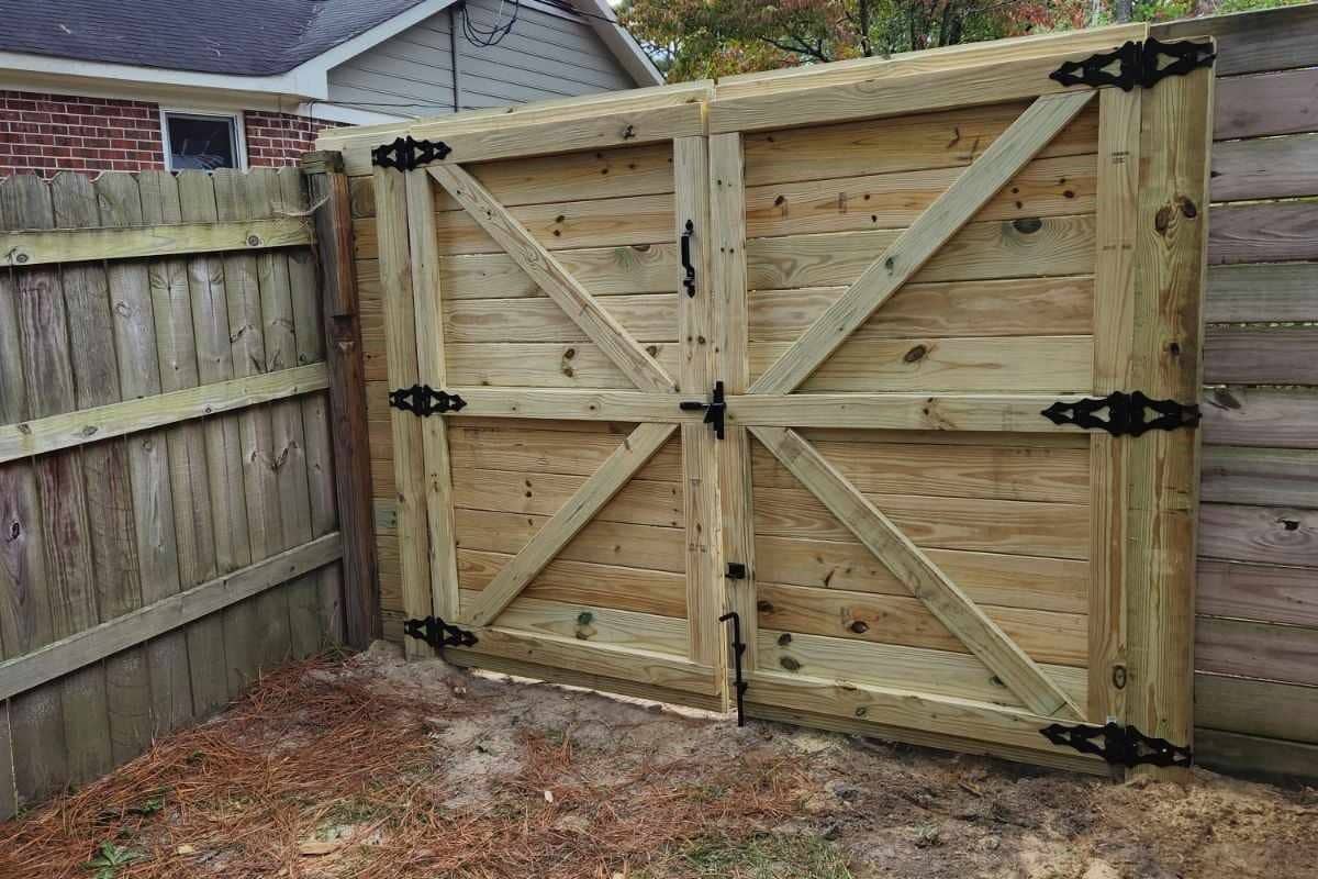 After photo of newly installed wooden privacy fence gate with new hardware in Fayetteville, NC.